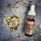 Fire of Desire Oil by Madame Pamita from Parlour of Wonders, featuring a small glass bottle with dark red oil and decorative label.
