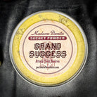 Grand Success Sachet Powder by Madame Pamita, shown in a small herbal sachet used for spiritual and ritual purposes.