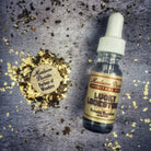 Lucky Lodestone Oil by Madame Pamita for attraction and luck, shown in a small glass bottle with a black cap.