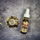 Magnetic Attraction Oil by Madame Pamita in a glass bottle with a black cap, labeled for energetic attraction and enhancement.