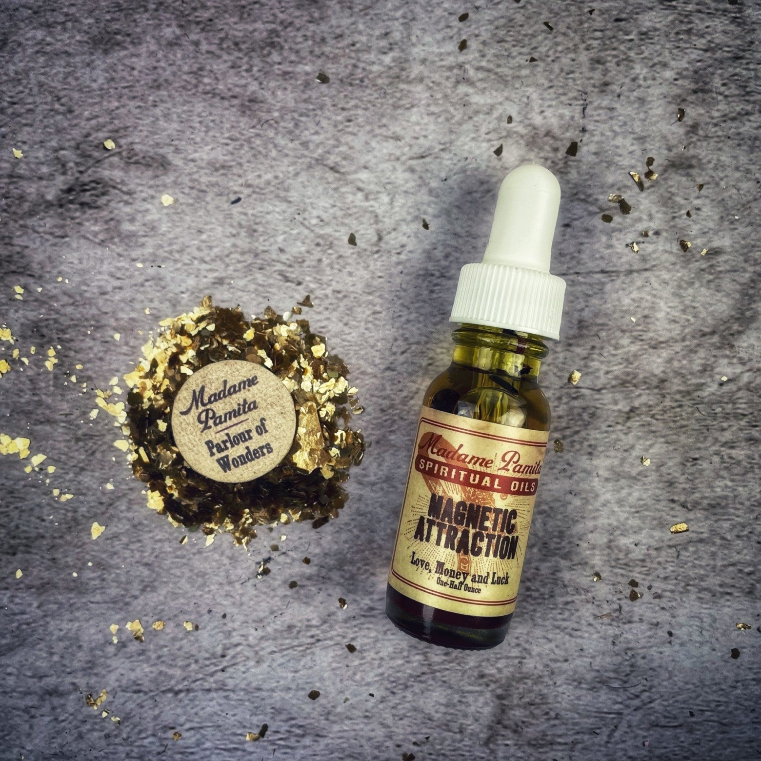Magnetic Attraction Oil by Madame Pamita in a glass bottle with a black cap, labeled for energetic attraction and enhancement.