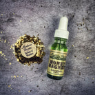Bottle of Money Magnet Oil by Madame Pamita from Parlour of Wonders, featuring a dark glass container with a gold label.