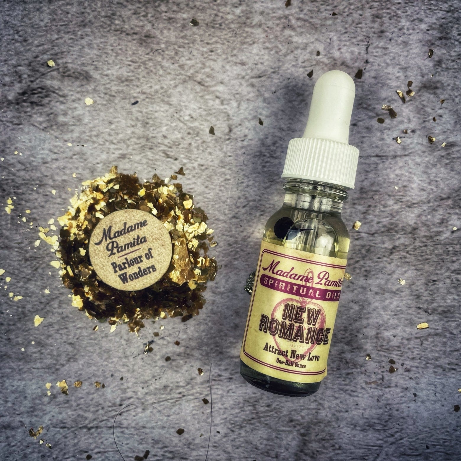Bottle of New Romance Oil by Madame Pamita from Parlour of Wonders, with a dark glass container and elegant label.