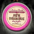 New Romance Sachet Powder by Madame Pamita from Parlour of Wonders, featuring a small, elegant sachet with aromatic powder inside.
