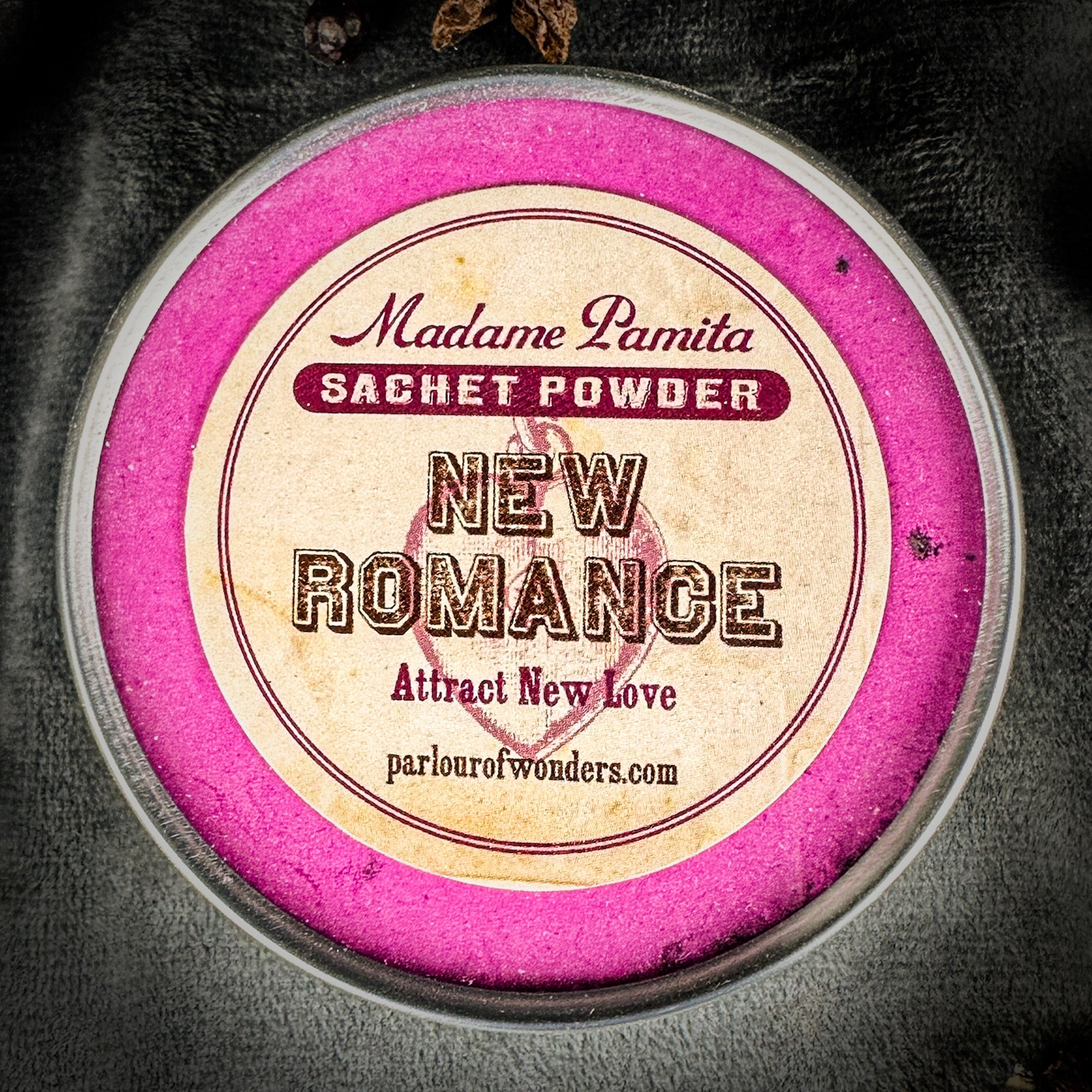 New Romance Sachet Powder by Madame Pamita from Parlour of Wonders, featuring a small, elegant sachet with aromatic powder inside.