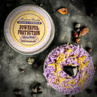 Powder sachet by Madame Pamita for powerful protection, featuring herbal ingredients in a small decorative pouch.