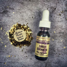 Queen Elizabeth Oil by Madame Pamita from Parlour of Wonders, displayed in a glass bottle with ornate label and botanical elements.