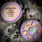 Queen Elizabeth Sachet Powder by Madame Pamita from Parlour of Wonders, shown in a decorative sachet with intricate design.