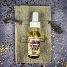Return to Me Oil by Madame Pamita from Parlour of Wonders, featuring a dark glass bottle and mystical label design.
