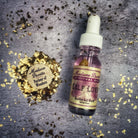 Self Love Oil by Madame Pamita from Parlour of Wonders, a small bottle with golden liquid and a decorative label.