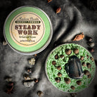 Steady Work Sachet Powder by Madame Pamita from Parlour of Wonders, featuring a small, labeled herbal powder packet on a white background.