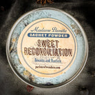 Sweet Reconciliation Sachet Powder by Madame Pamita from Parlour of Wonders, shown in a small, sealed sachet with decorative labeling.