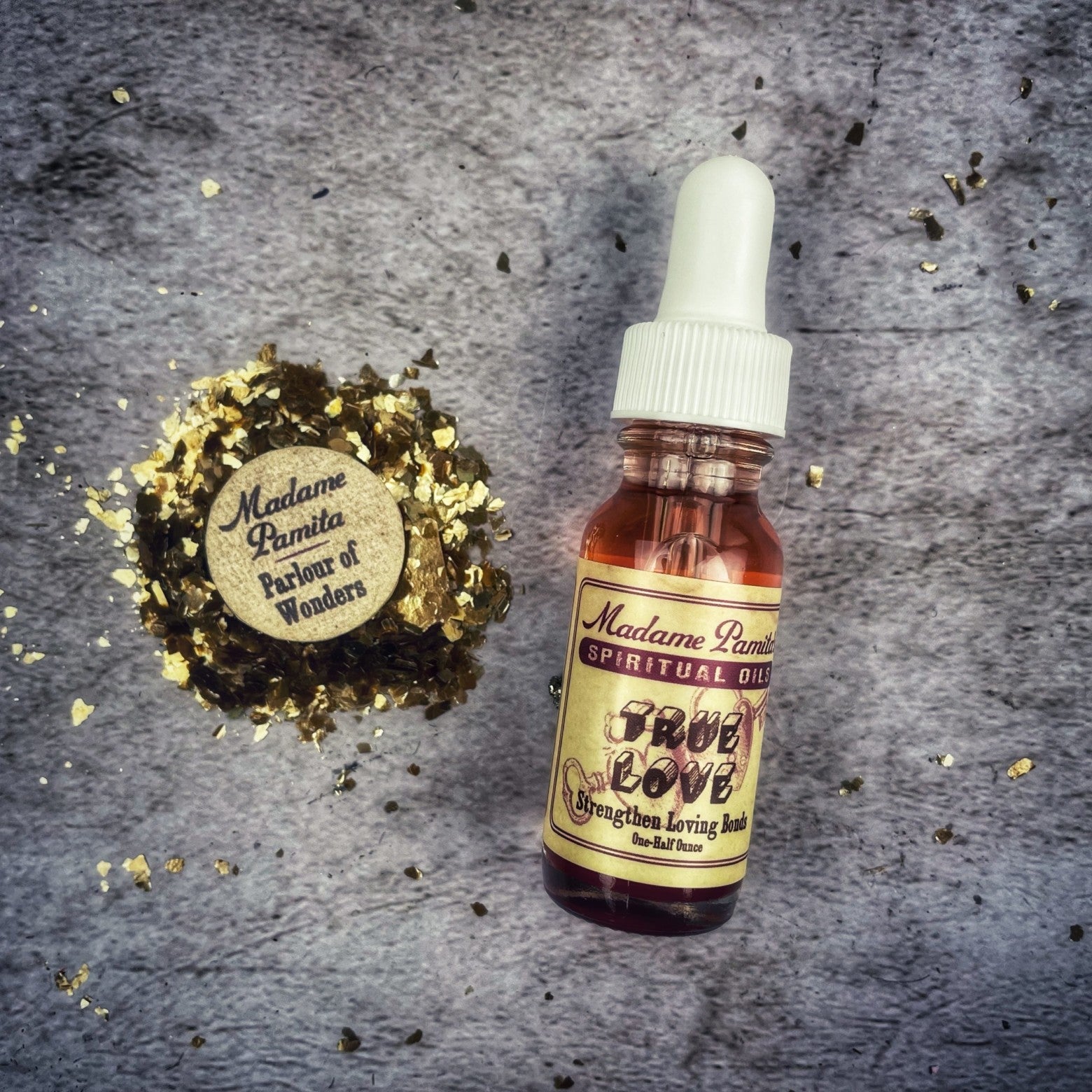Bottle of True Love Oil by Madame Pamita from Parlour of Wonders, featuring a dark glass container with a label.