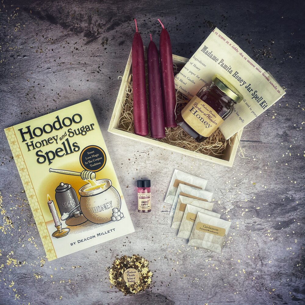 Parlour of Wonders Honey Jar Spell Kit with ingredients for love spells, featuring a glass jar, herbs, and decorative elements.
