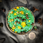Small jar of Parlour of Wonders Abundant Prosperity Bath Crystals with colorful crystals for relaxing bath rituals.