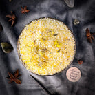 Small jar of Parlour of Wonders Grand Success Bath Crystals with colorful crystals and a decorative label, ideal for relaxing baths.