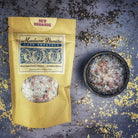 Small jar of Parlour of Wonders New Romance Bath Crystals with pink and white crystals in clear packaging.