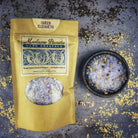 Small jar of Parlour of Wonders Queen Elizabeth Bath Crystals with colorful crystals and elegant packaging.