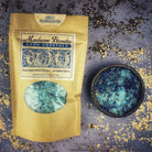 Small jar of Parlour of Wonders Sweet Reconciliation Bath Crystals with pink and white crystals, designed for relaxing bath experiences.