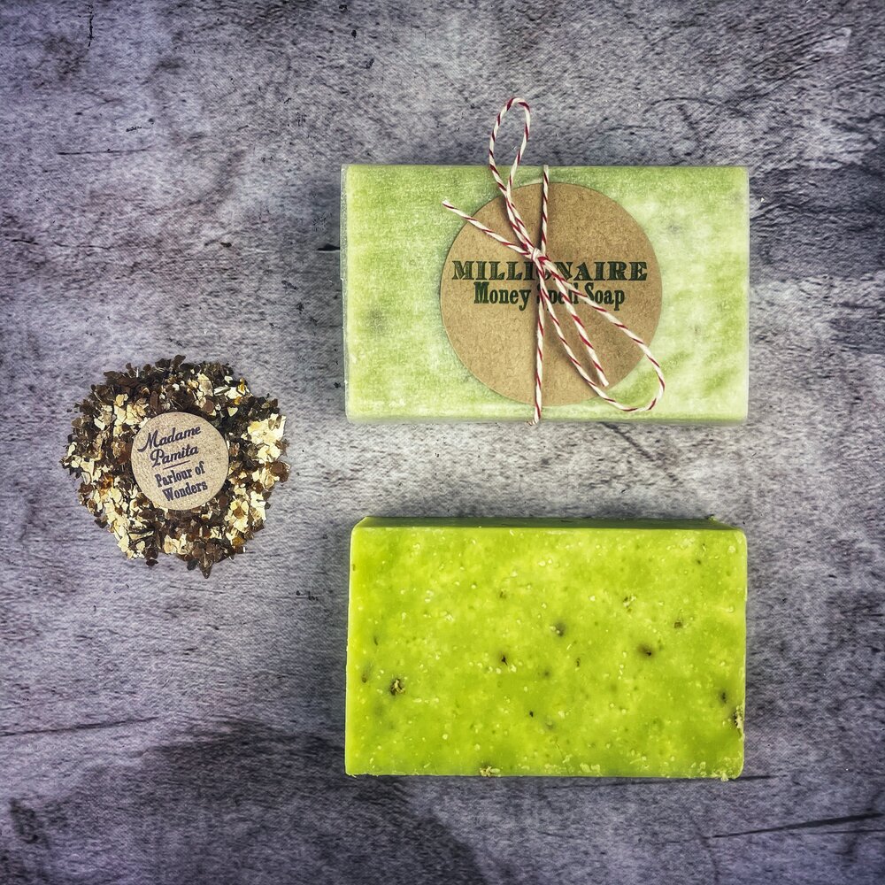 Parlour of Wonders Millionaire Money Spell Soap with gold and green swirling design, infused with herbal ingredients for wealth attraction.