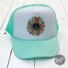 Seafoam and white foam trucker cap with peace sunflower design by The Graphic Tee, featuring adjustable mesh back and curved brim.