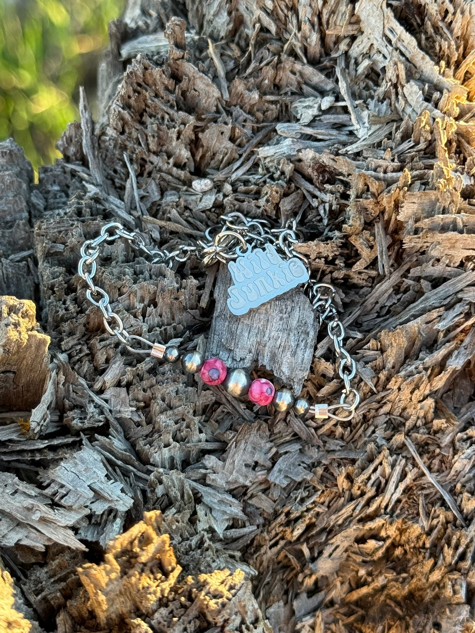 Pink mosaic beaded chain bracelet by Wild Junkie featuring intricate beadwork and a delicate chain design.