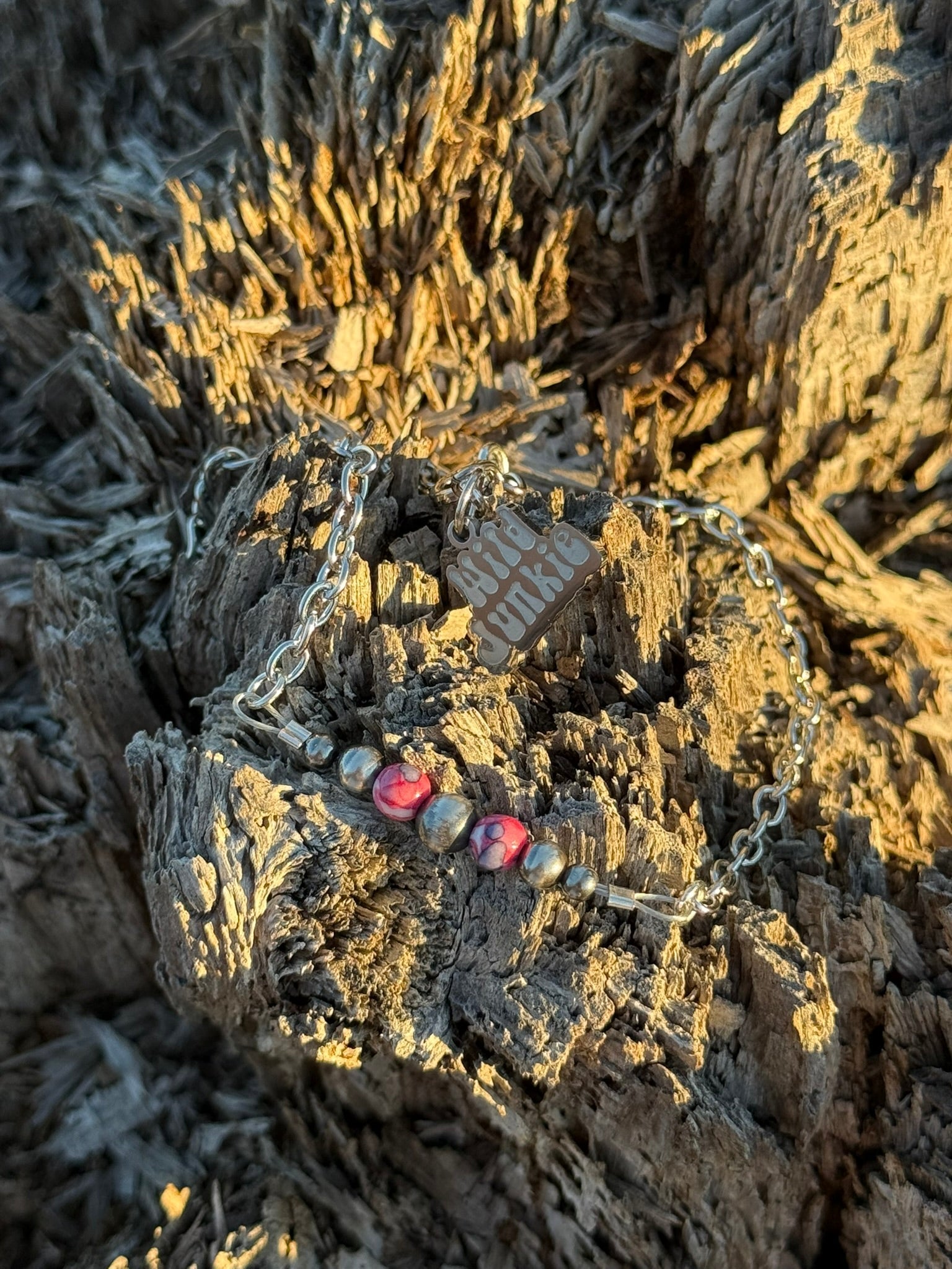 Pink mosaic beaded chain bracelet by Wild Junkie featuring intricate beaded designs and a delicate chain for stylish wristwear.