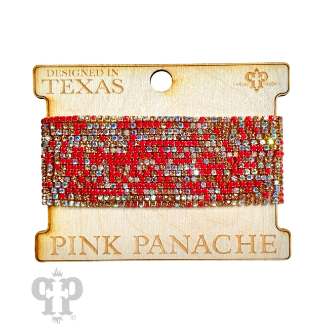 Multiple strands of pink Panache Brands rhinestone bracelet set featuring sparkling black rhinestones and elegant design.