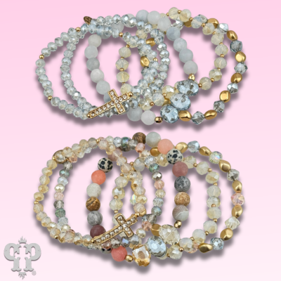 Pink Panache Brands faceted bead multi-strand bracelet stack with rhinestone cross, featuring blue beads and layered design.