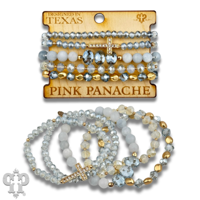 Multi-strand bracelet stack with pink faceted beads and rhinestone cross from Pink Panache Brands.