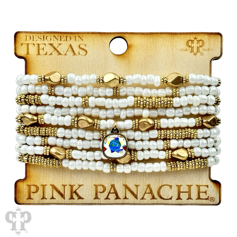 Stacked bracelet featuring gold, silver, and white pony beads with a pink Panache Brands logo, stylish and colorful accessory.