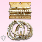 White stone, crystal, and gold bead bracelet by Pink Panache Brands featuring elegant gold accents and a delicate, stylish design.