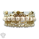 White stone, crystal, and gold bead bracelet featuring Pink Panache Brands' elegant jewelry design.