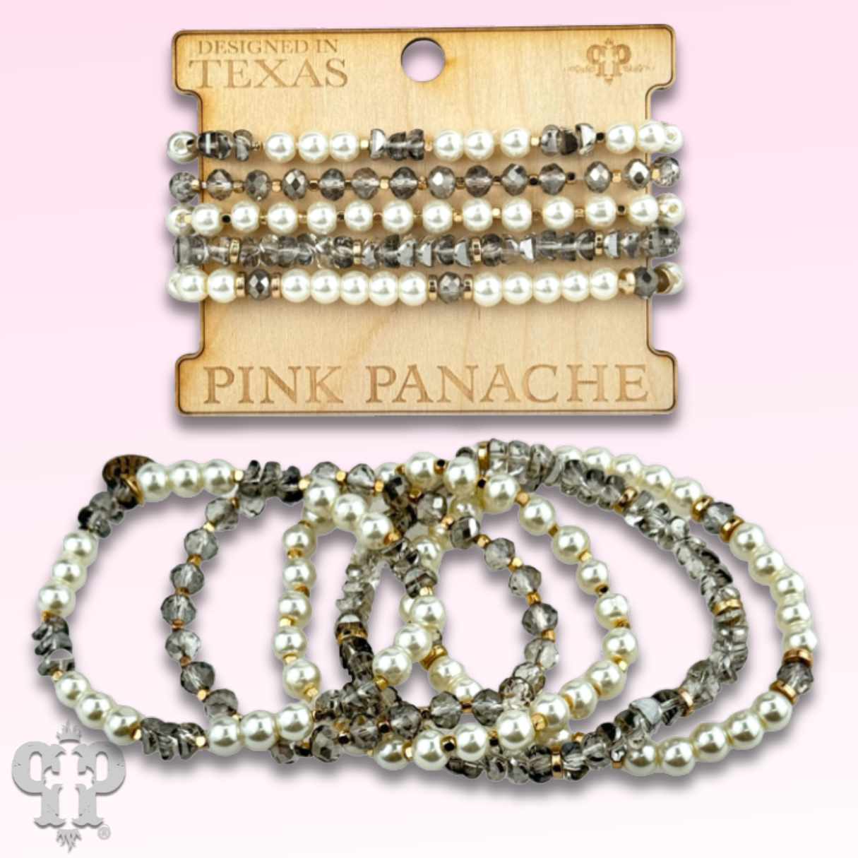 Stack of pink and gray pearl and faceted bead bracelets by Pink Panache Brands, showcasing elegant jewelry design.