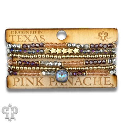 Colorful faceted round and star beads bracelet stack with Austrian crystals, stylish pink Panache Brands jewelry for a layered look.