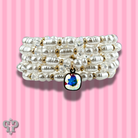 Cream pearl bead bracelet stack with Austrian crystals from Pink Panache Brands, featuring elegant white pearl and crystal accents.