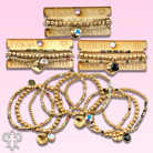 Matte gold and square glass bead bracelet stack with Austrian crystals, stylish jewelry by Pink Panache Brands.