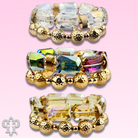 Stack of pink Panache Brands octagon-shaped faceted bead bracelets with white beads, stylish and versatile jewelry accessory.