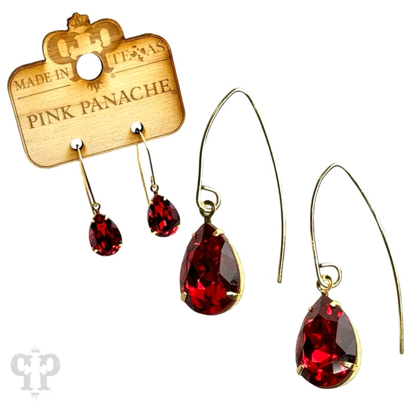 Blue and gold Austrian crystal pear drop earrings by Pink Panache Brands, featuring elegant dangling gemstone design