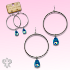 Turquoise blue rhinestone teardrop earrings by Pink Panache Brands featuring sparkling rhinestones and elegant teardrop shape.