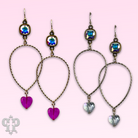 Pink Panache Brands crystal heart teardrop earrings with vibrant fuchsia Austrian crystals and elegant silver hooks.