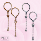 Gold post earring with star and drop design from Pink Panache Brands, featuring a sleek, elegant style.