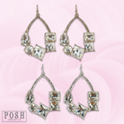 Silver teardrop earrings with colorful rhinestones by Pink Panache Brands, showcasing elegant jewelry design.