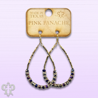 Faceted purple crystal bead teardrop earrings by Pink Panache Brands, showcasing elegant dangling design with sparkling crystal details.