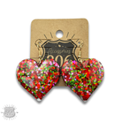 Red acrylic glitter heart earring from Pink Panache Brands, stylish jewelry accessory with a shiny, eye-catching heart design.