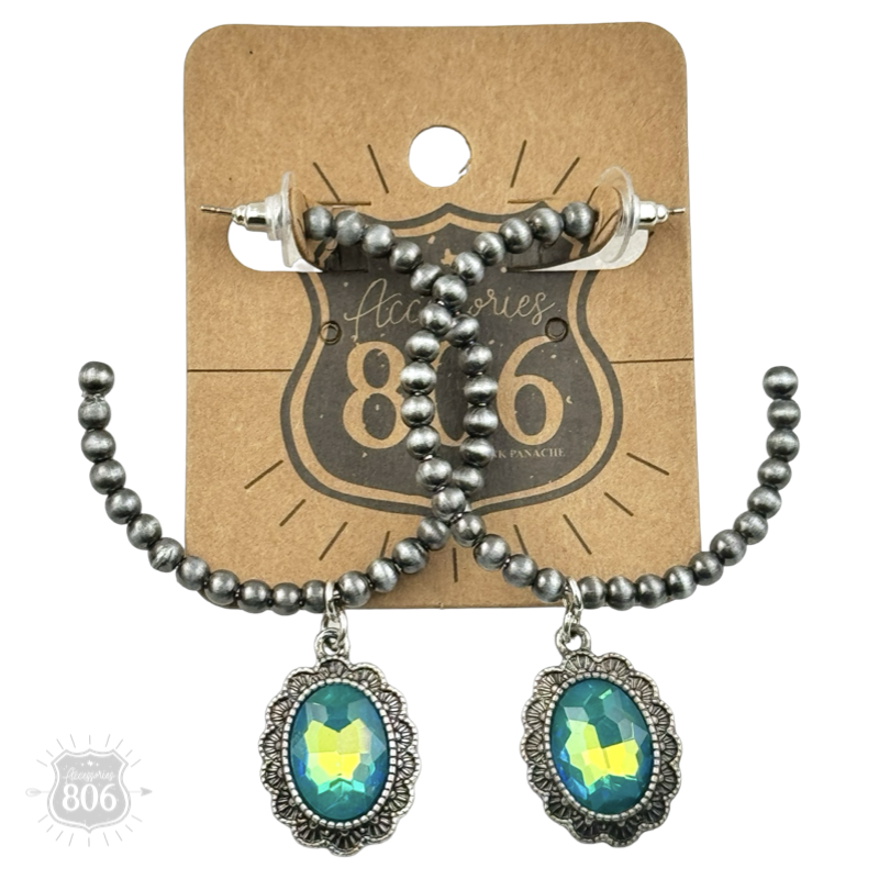 Silver Navajo style bead hoop earring with oval rhinestone charm from Pink Panache Brands, featuring intricate bead details and sparkling accents.