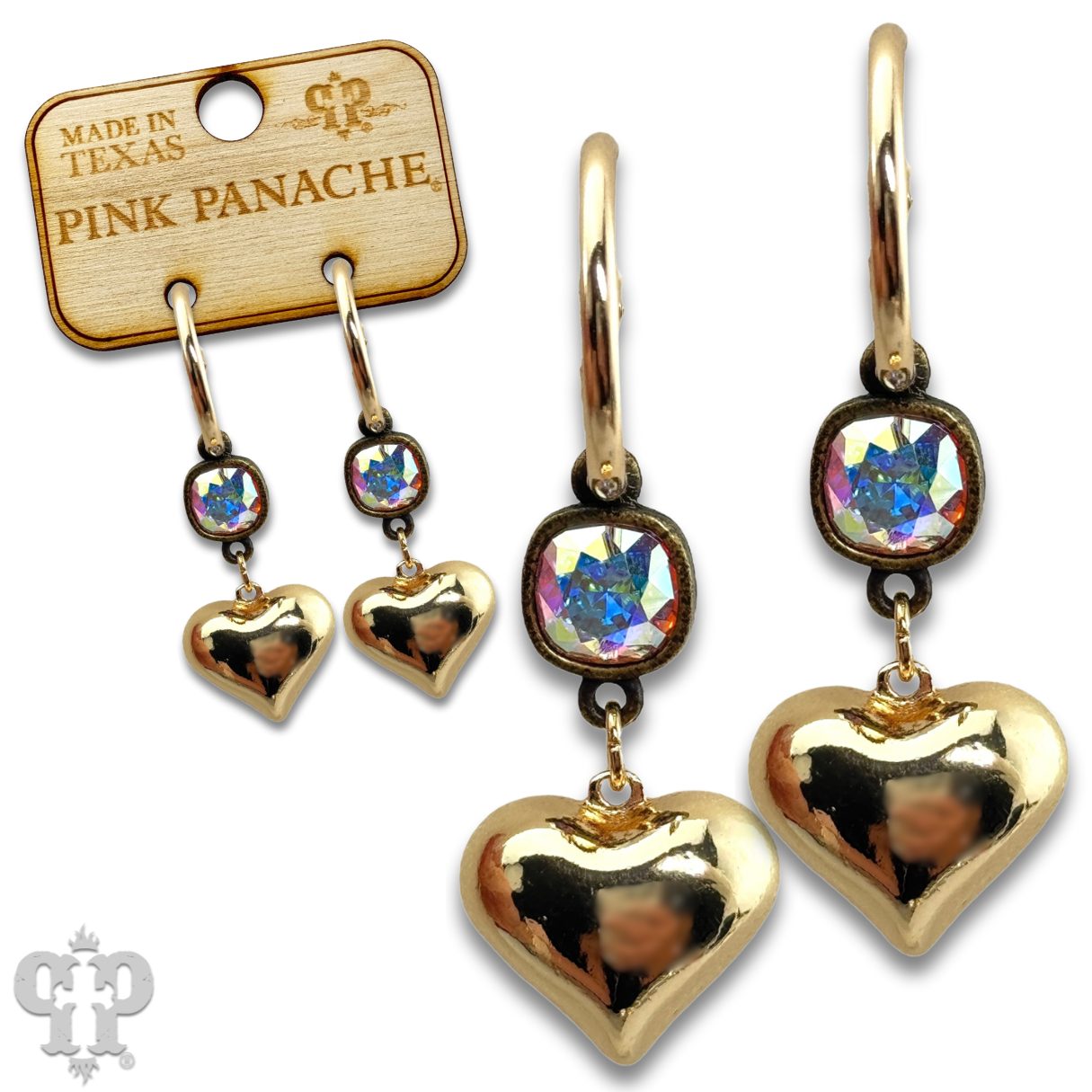 Silver puffed heart earring with Austrian crystal by Pink Panache Brands, showcasing a shiny, elegant jewelry design.