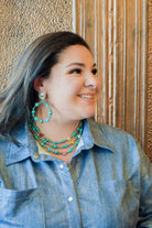 Turquoise tone bead buffalo nickel earring by Pink Panache Brands, showcasing a boho-style dangle earring with natural stone detail.