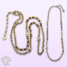 Gold chain and champagne bead necklace by Pink Panache Brands featuring a delicate gold-toned chain with elegant champagne-colored beads.