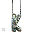 Silver necklace with a rhinestone letter pendant, featuring a pink Panache Brands design and elegant jewelry style